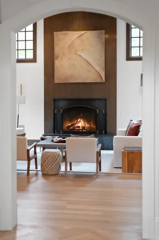 a living room with furniture and a fireplace