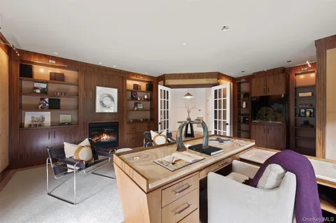 a kitchen with a sink and chairs