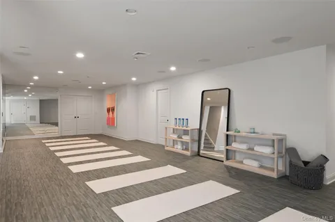 a view of kitchen with sink and refrigerator