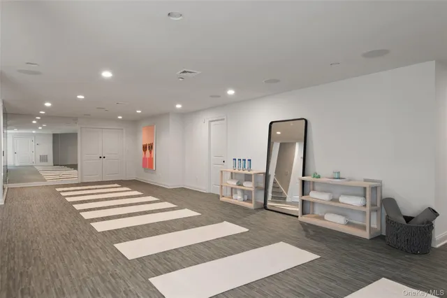 a view of kitchen with sink and refrigerator