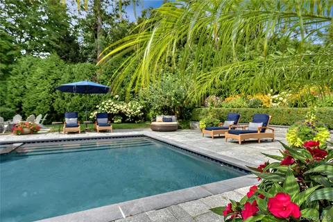 a view of a backyard with sitting area and furniture