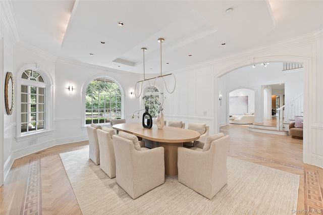 a living room with a sink and chandelier