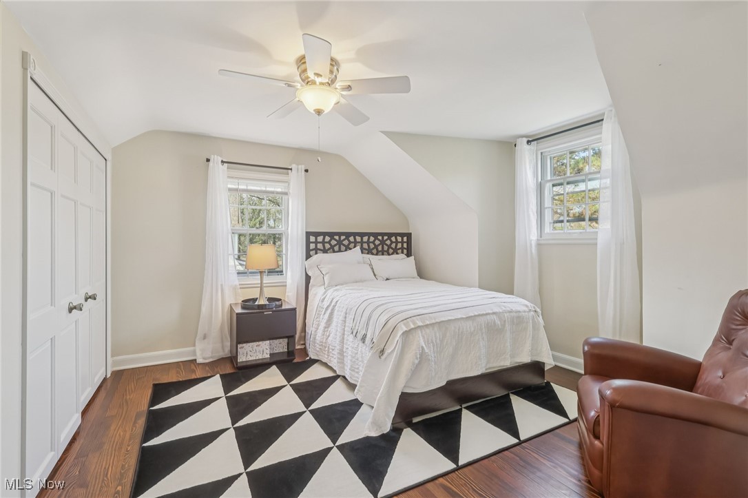 17024 Fernway Road Cleveland, OH 44120 - Photo 29 of 46 Bedroom featuring wood flooring, multiple windows, vaulted ceiling, and a closet