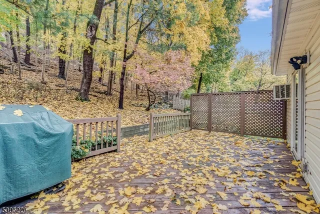 a backyard of a house with large trees