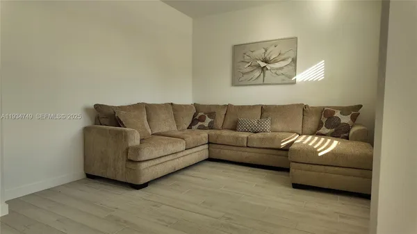 a living room with furniture and a couch