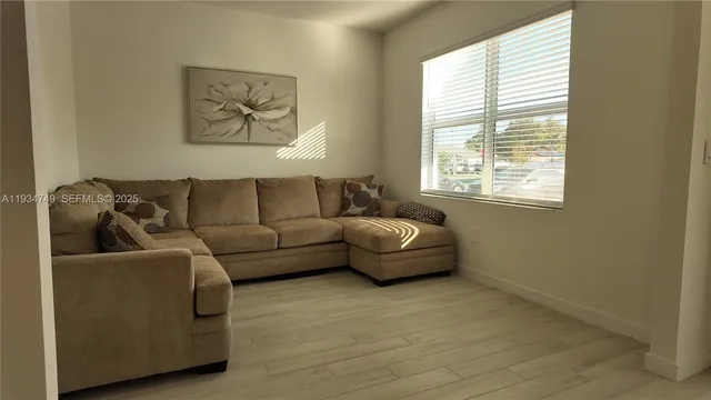 a living room with furniture and a window