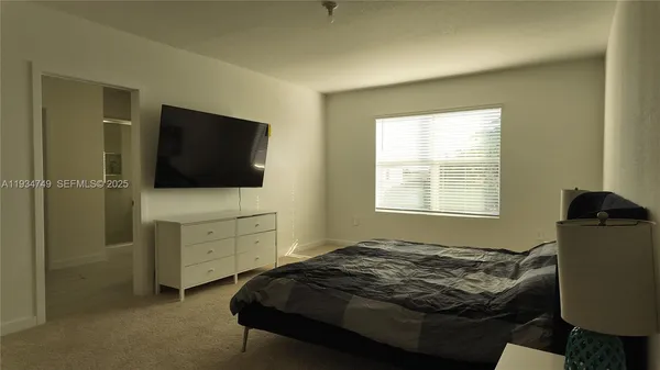 a bedroom with a bed and furniture