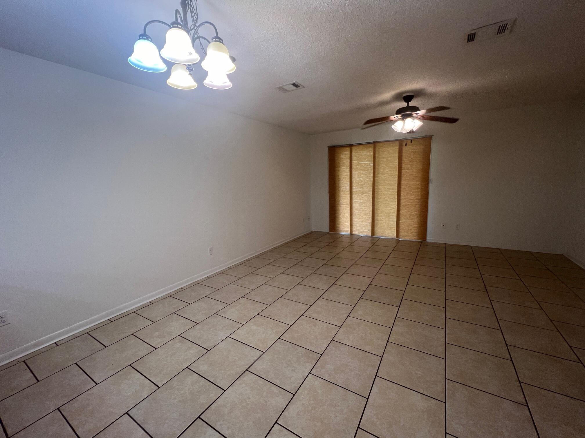 115 Hughes Street Northeast, Unit D4 Fort Walton Beach, FL 32548 - Photo 12 of 29 a view of an empty room with a window