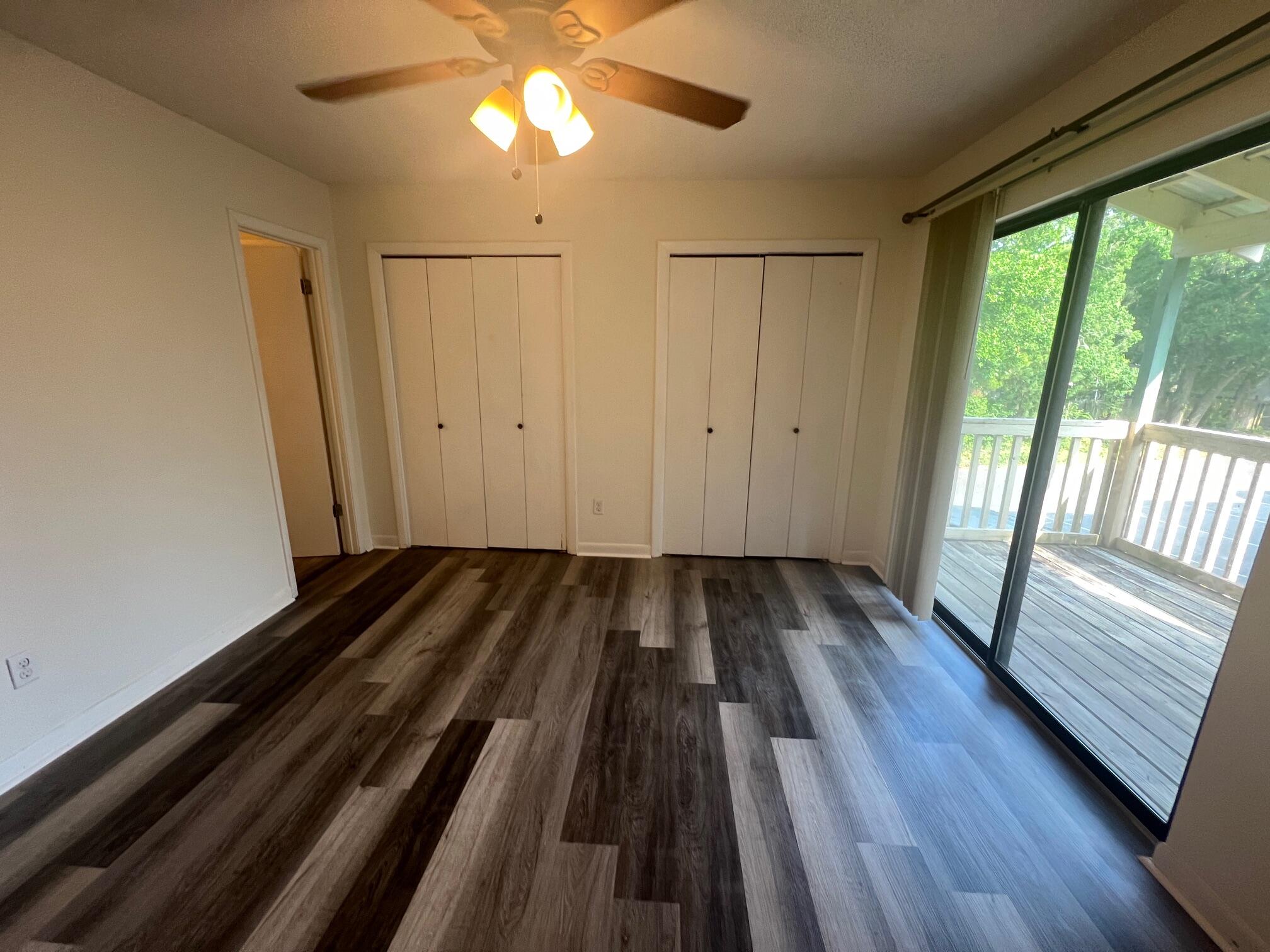 115 Hughes Street Northeast, Unit D4 Fort Walton Beach, FL 32548 - Photo 19 of 29 a view of a room with wooden floor and window