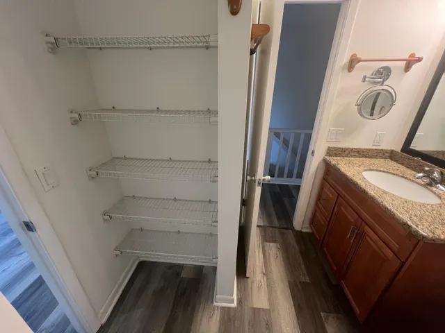 a bathroom with a toilet a sink and a mirror