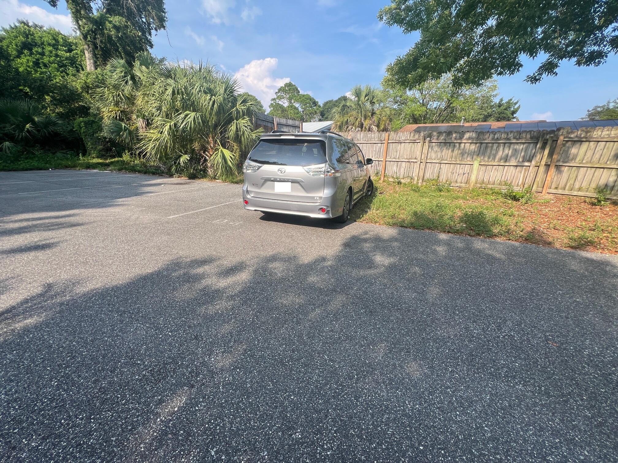 115 Hughes Street Northeast, Unit D4 Fort Walton Beach, FL 32548 - Photo 5 of 29 a car parked on the side of the road