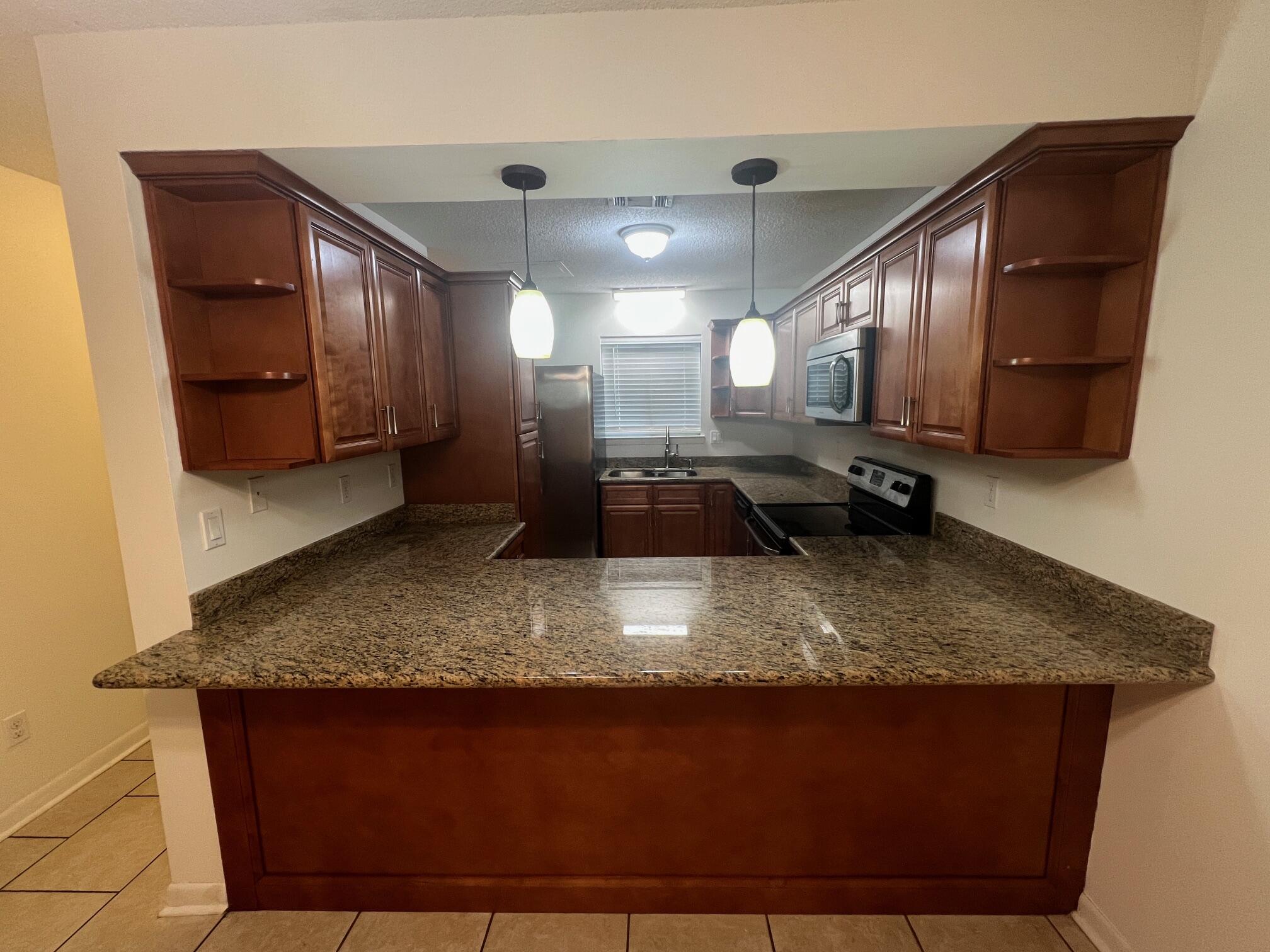 115 Hughes Street Northeast, Unit D4 Fort Walton Beach, FL 32548 - Photo 6 of 29 a view of a kitchen counter space