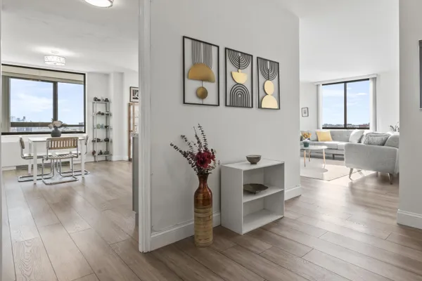 a living room with furniture and a large window
