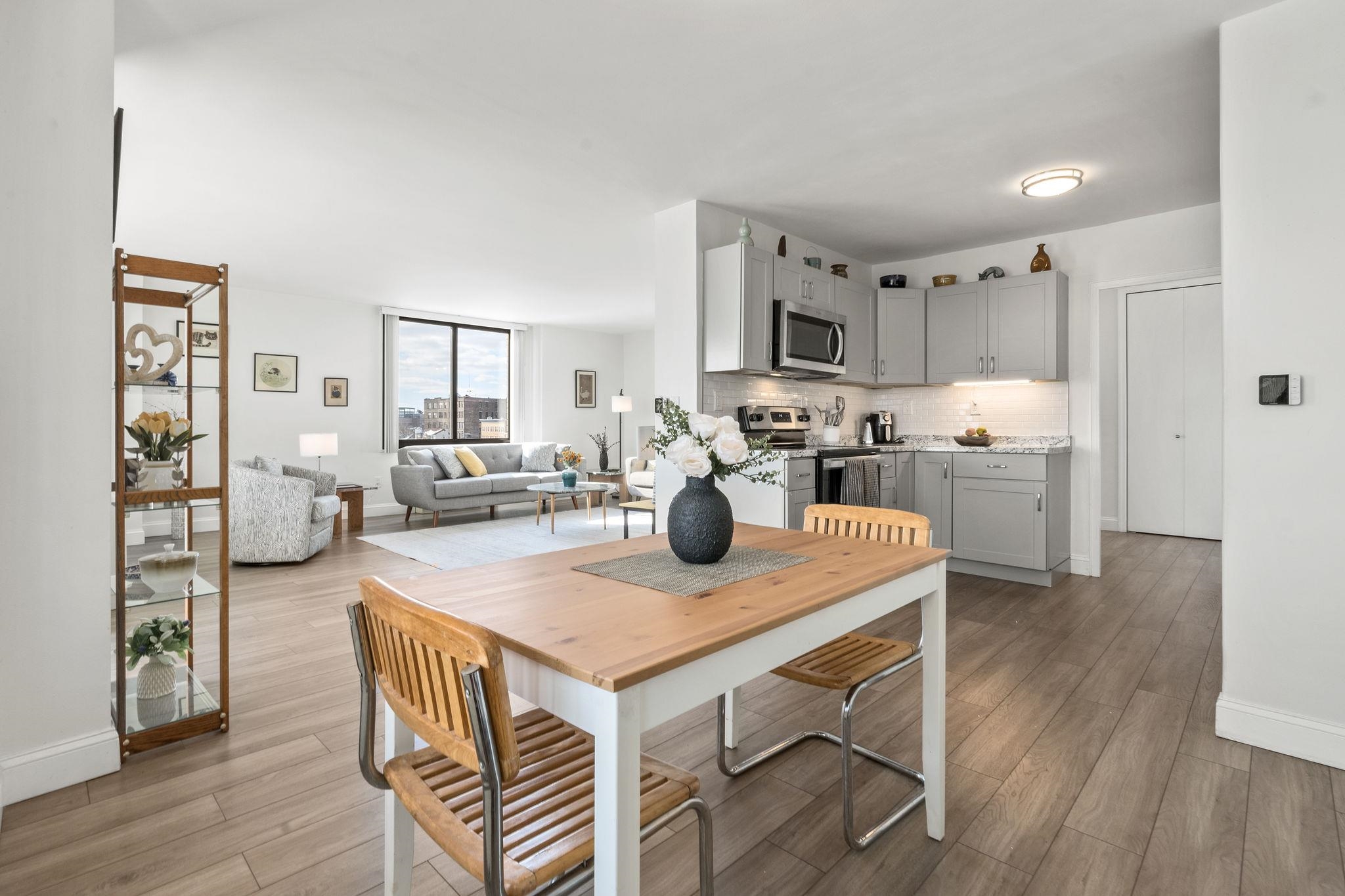 380 Mountain Road, Unit 813 Union City, NJ 07087 - Photo 12 of 40 a view of kitchen with cabinets and wooden floor