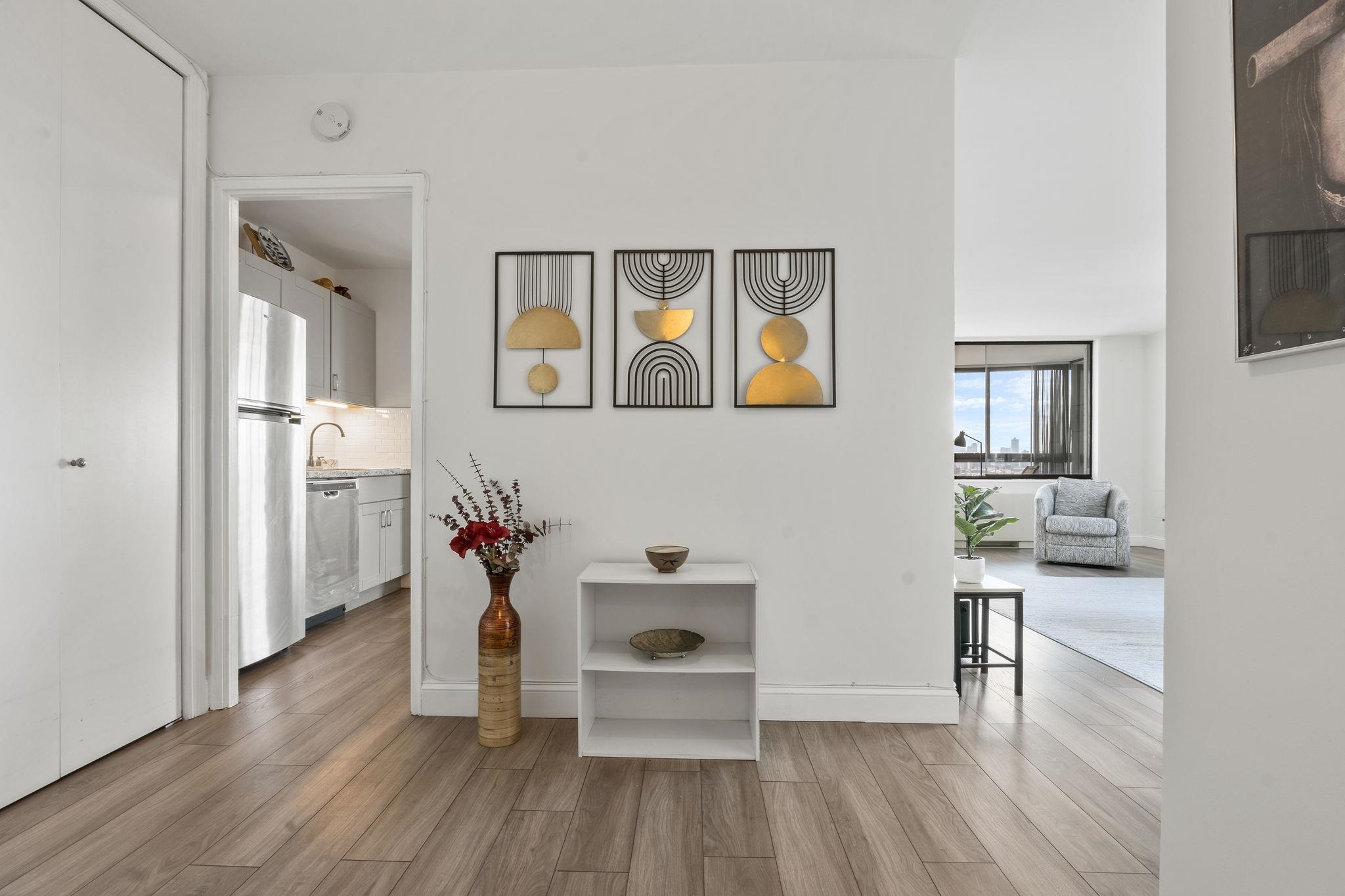 380 Mountain Road, Unit 813 Union City, NJ 07087 - Photo 17 of 40 a living room with furniture and wooden floor