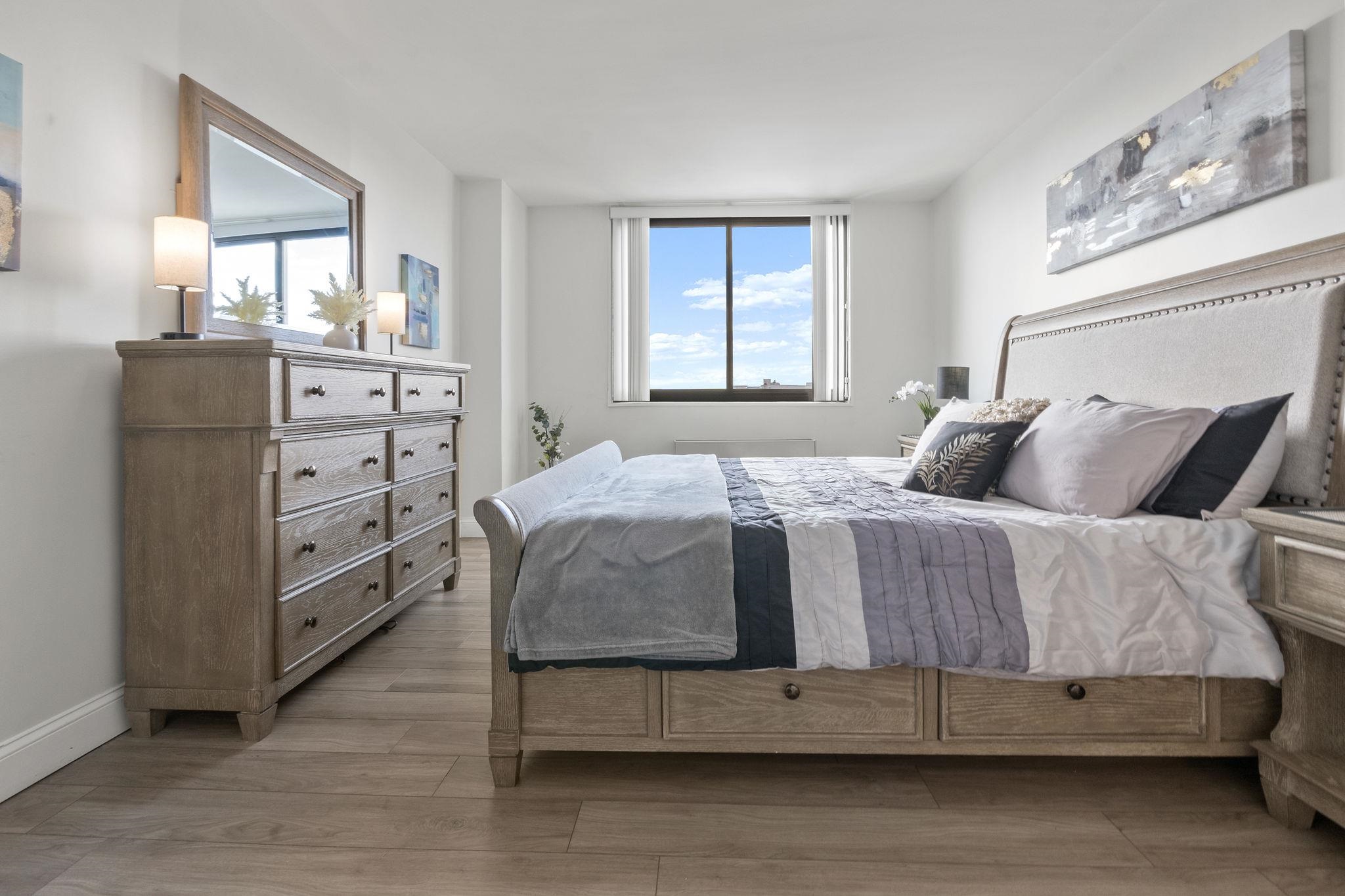 380 Mountain Road, Unit 813 Union City, NJ 07087 - Photo 19 of 40 a bedroom with a bed and a dresser