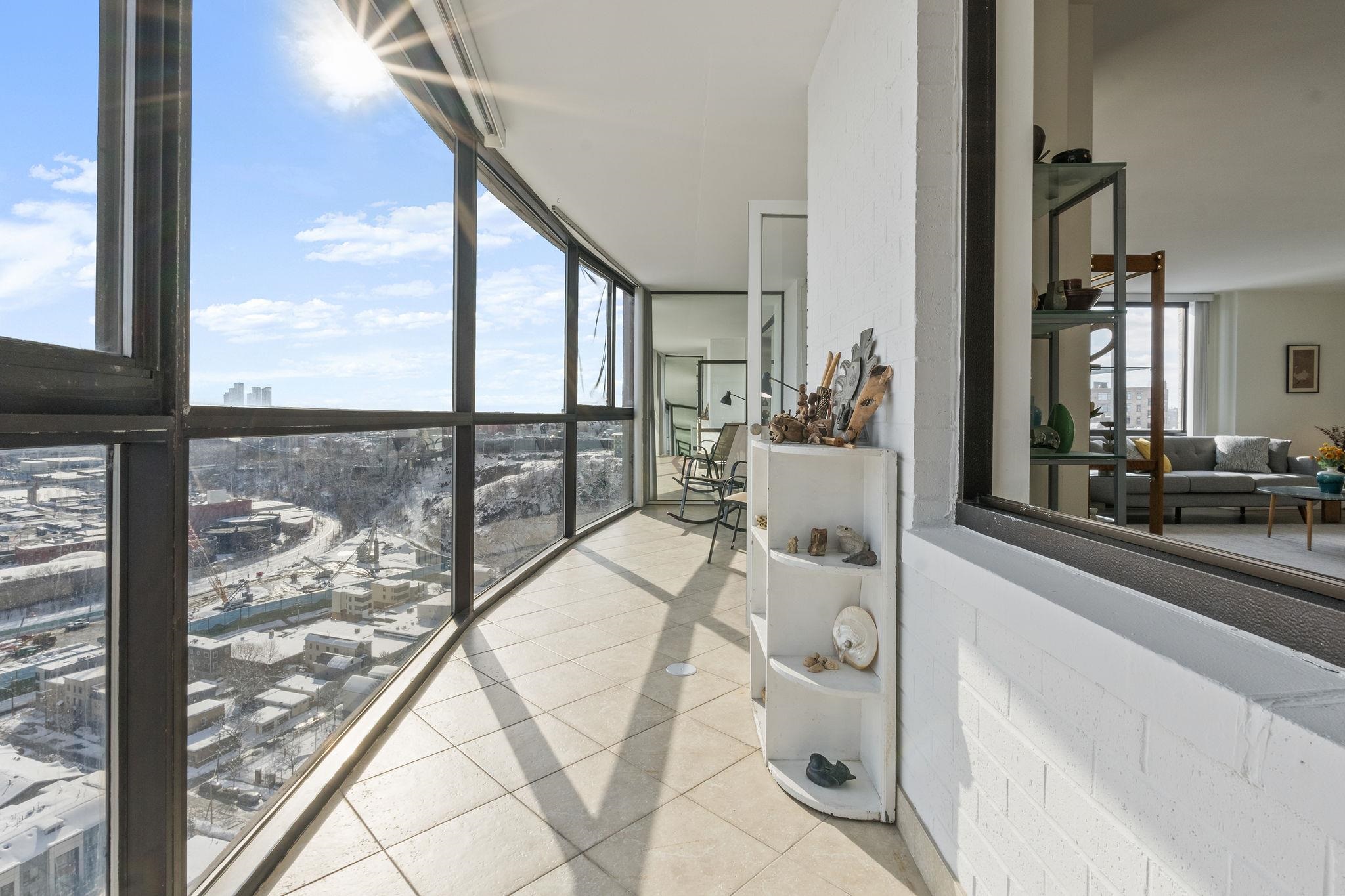 380 Mountain Road, Unit 813 Union City, NJ 07087 - Photo 9 of 40 a view of a living room and floor to ceiling window or kitchen