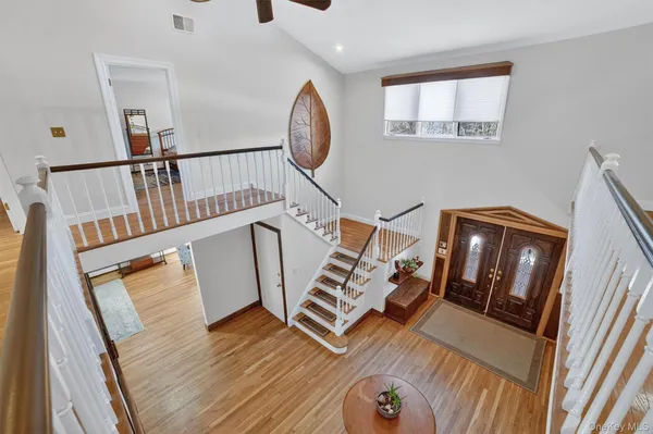 a view of an entryway with wooden floor
