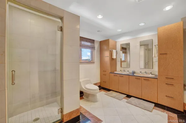 a bathroom with a granite countertop sink mirror and a bathtub