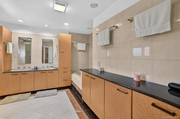 a kitchen with granite countertop a sink and a stove
