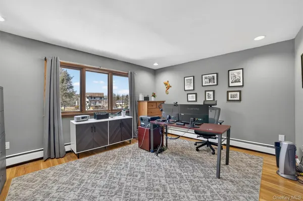 a living room with furniture a rug and a window