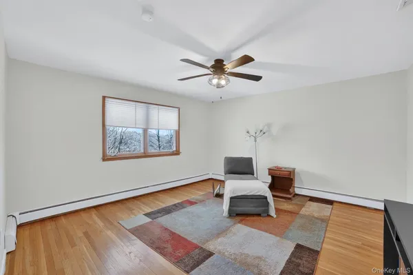 a living room with furniture rug and a wooden floor