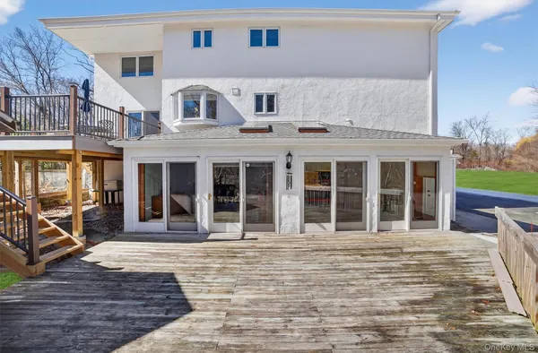 a front view of a house with a lots of windows