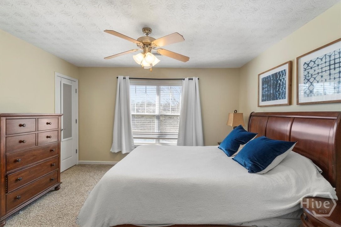 1021 Azalea Street Greensboro, GA 30642 - Photo 17 of 33 PRIMARY BEDROOM ON BACK OF HOME OVERLOOKING POND