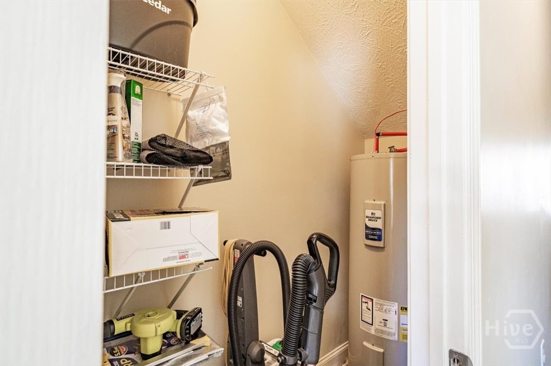 1021 Azalea Street Greensboro, GA 30642 - Photo 6 of 33 STORAGE UNDER STAIRS WITH WATER HEATER