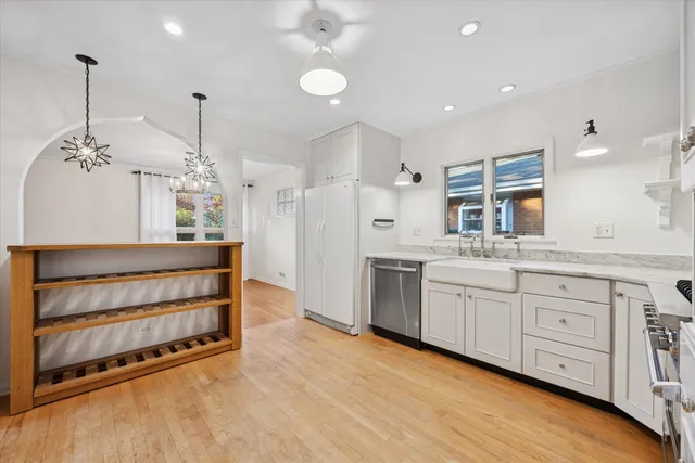 a kitchen with sink and cabinets