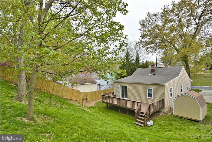4502 Mahan Road Silver Spring, MD 20906 - Photo 9 of 30 a view of house with a yard and large trees