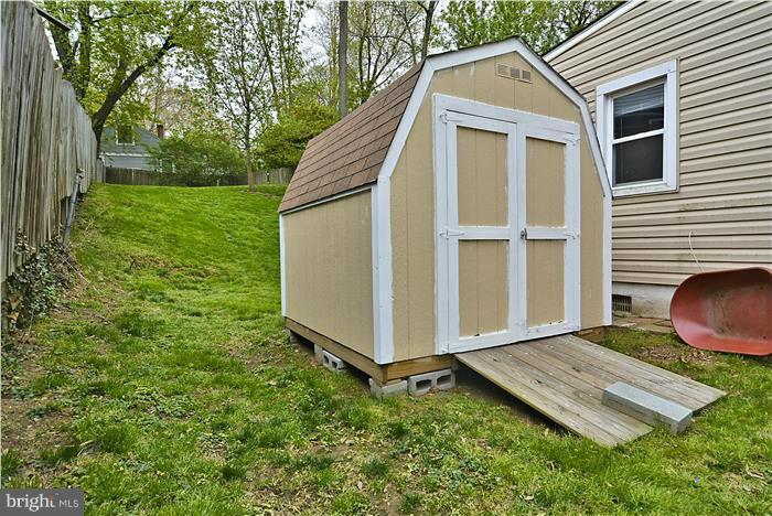 4502 Mahan Road Silver Spring, MD 20906 - Photo 12 of 30 a backyard of a house with lots of green space