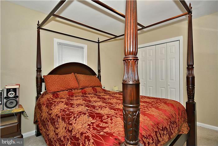 4502 Mahan Road Silver Spring, MD 20906 - Photo 18 of 30 a bed sitting in a bedroom next to a window