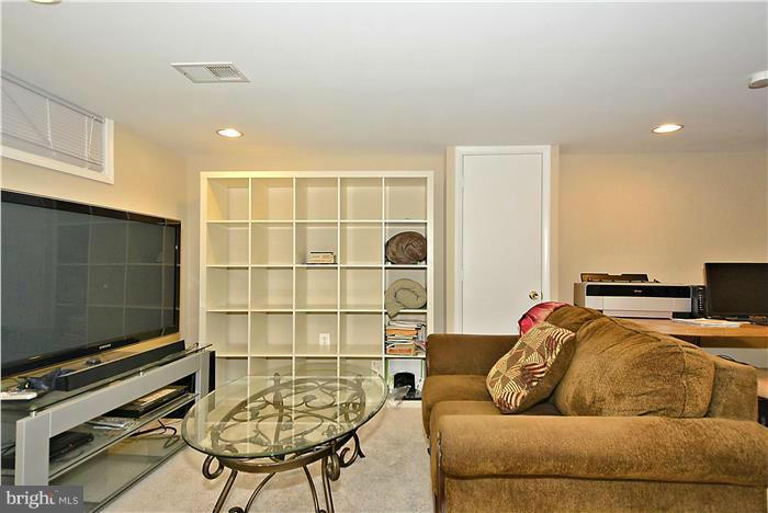 4502 Mahan Road Silver Spring, MD 20906 - Photo 24 of 30 a living room with furniture and a flat screen tv
