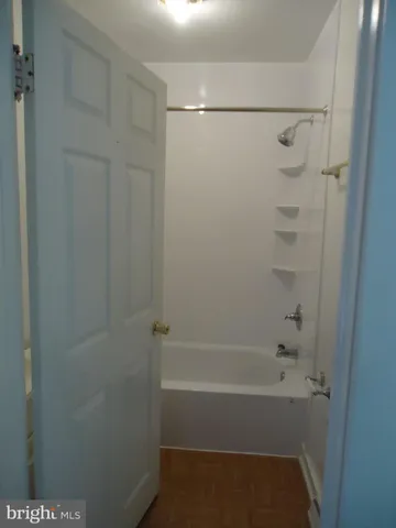 a view of a house with a door and wooden floor