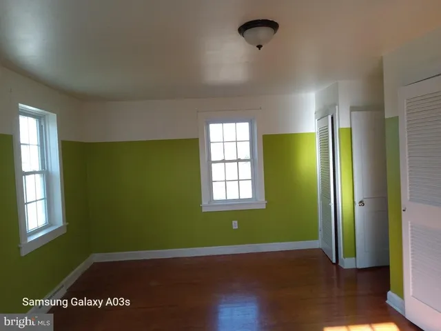 a kitchen with granite countertop a stove a sink and a microwave