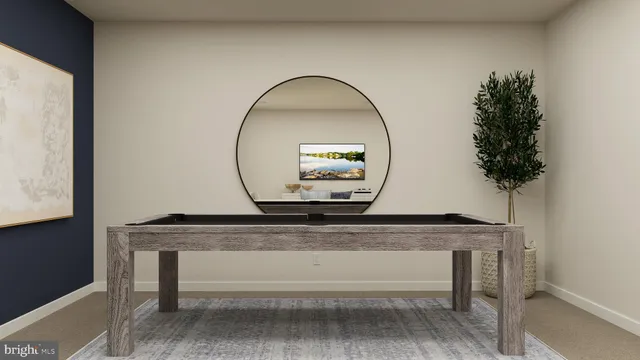 a living room with a table and a potted plant