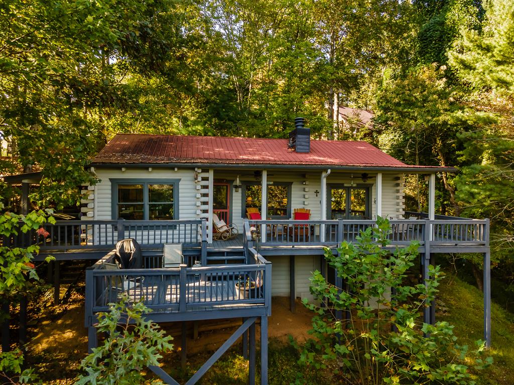 541 Mountain View Circle Blue Ridge, GA 30513 - Photo 1 of 38 a table and chairs under an umbrella
