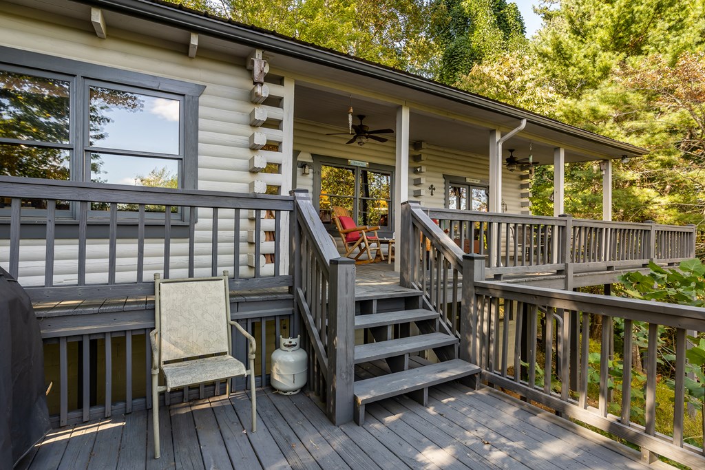 541 Mountain View Circle Blue Ridge, GA 30513 - Photo 31 of 38 a view of a deck with chairs and wooden floor