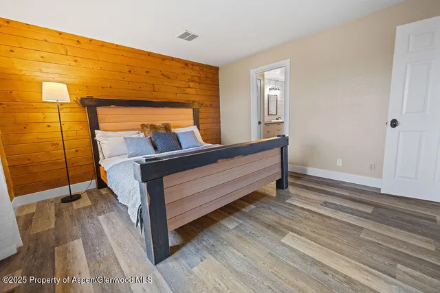 a view of a livingroom with furniture and a window