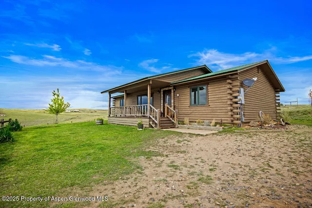 a view of a kitchen with white cabinets