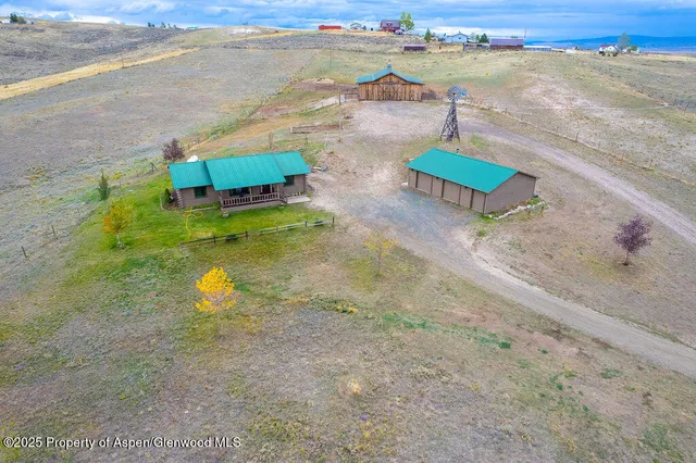 a kitchen with stainless steel appliances granite countertop a refrigerator and a stove