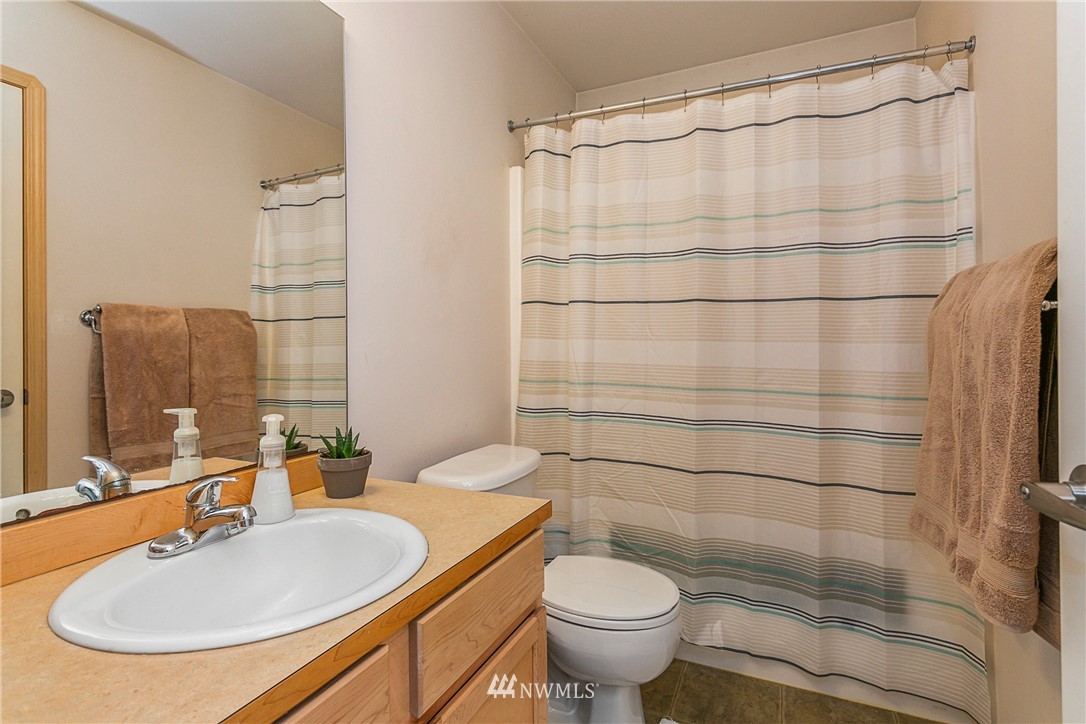 19010 4th Avenue Southeast Bothell, WA 98012 - Photo 13 of 20 a bathroom with a sink toilet and shower