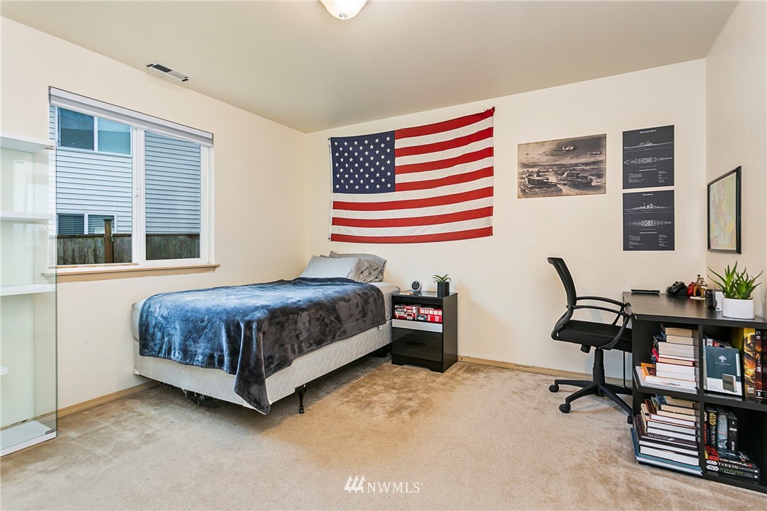19010 4th Avenue Southeast Bothell, WA 98012 - Photo 18 of 20 a bedroom with a bed and a desk