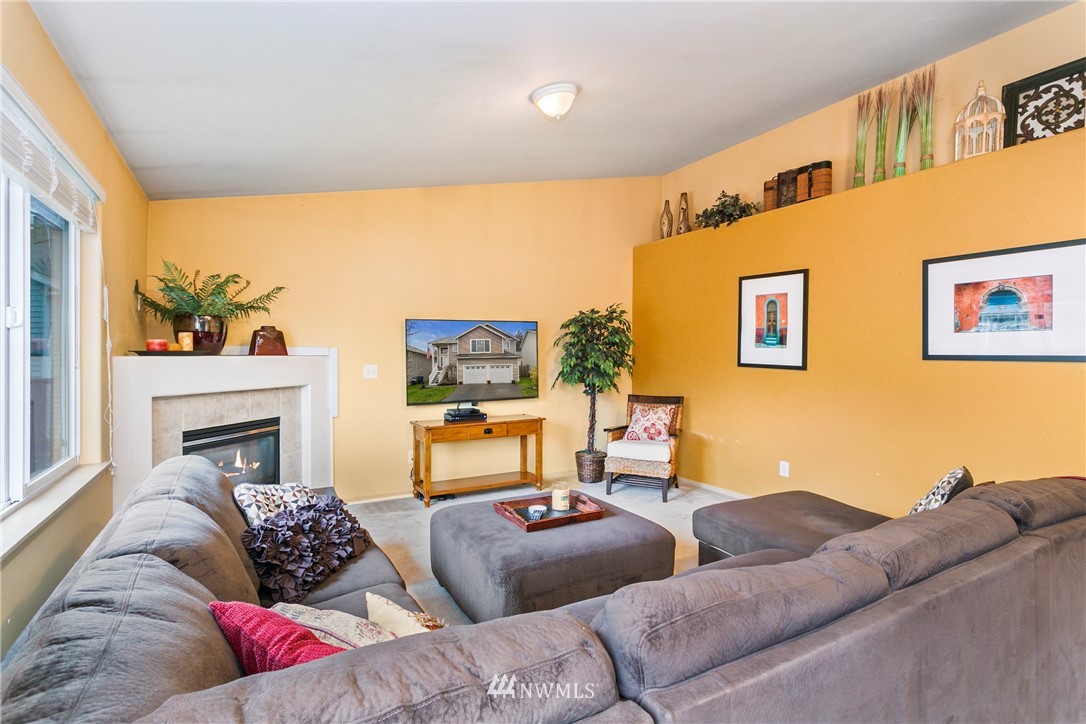 19010 4th Avenue Southeast Bothell, WA 98012 - Photo 3 of 20 a living room with furniture and a fireplace