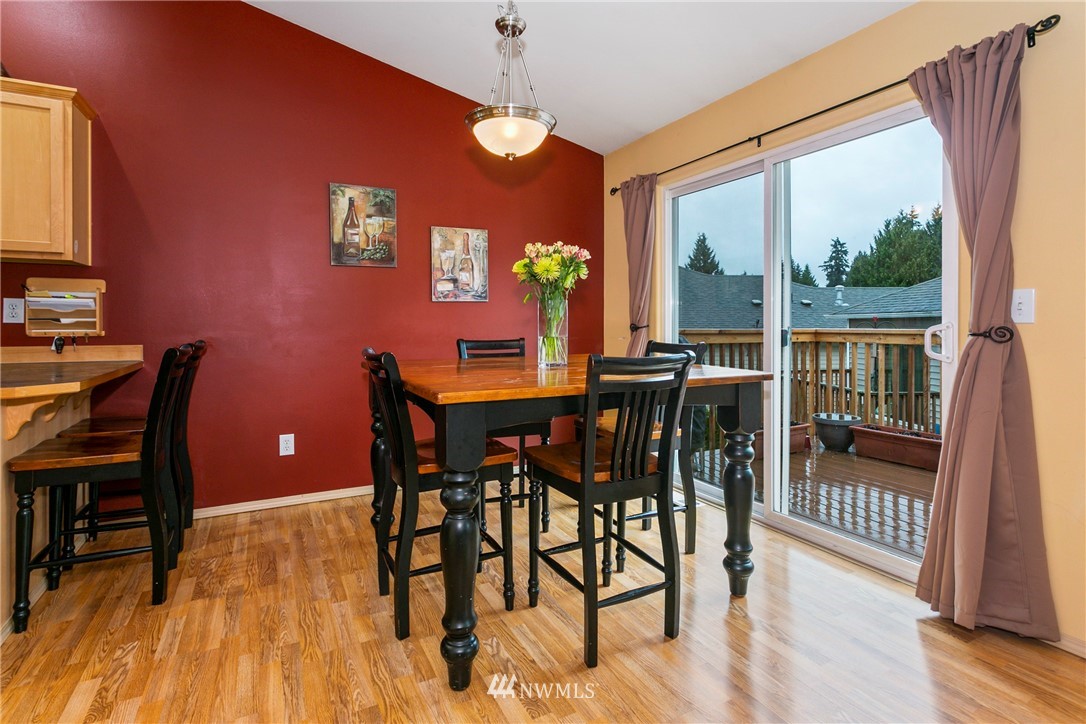 19010 4th Avenue Southeast Bothell, WA 98012 - Photo 9 of 20 a view of a dining room with furniture window and wooden floor