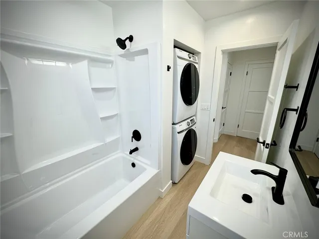 a bathroom with a sink a bathtub and a shower