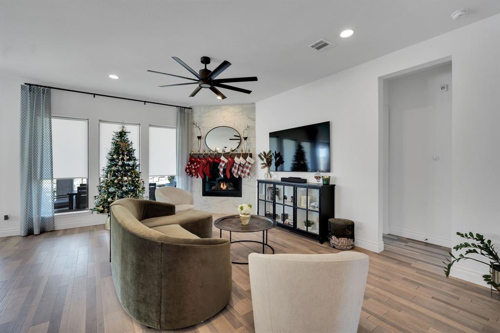 2221 Meridian Place Midlothian, TX 76065 - Photo 11 of 39 a living room with furniture and a flat screen tv