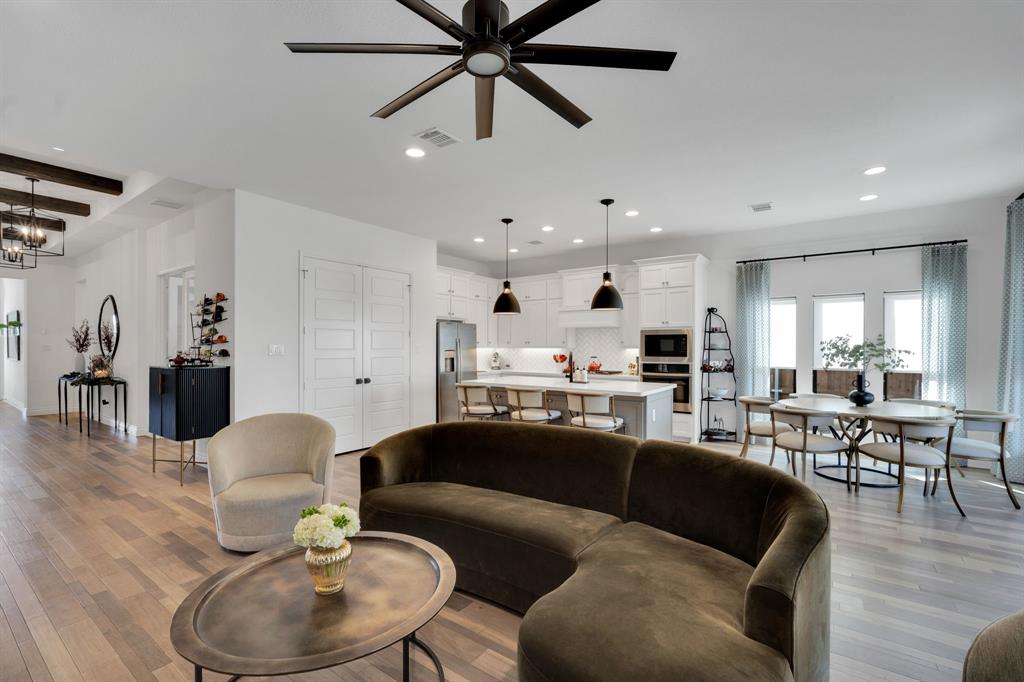 2221 Meridian Place Midlothian, TX 76065 - Photo 12 of 39 a living room with furniture kitchen view and a wooden floor