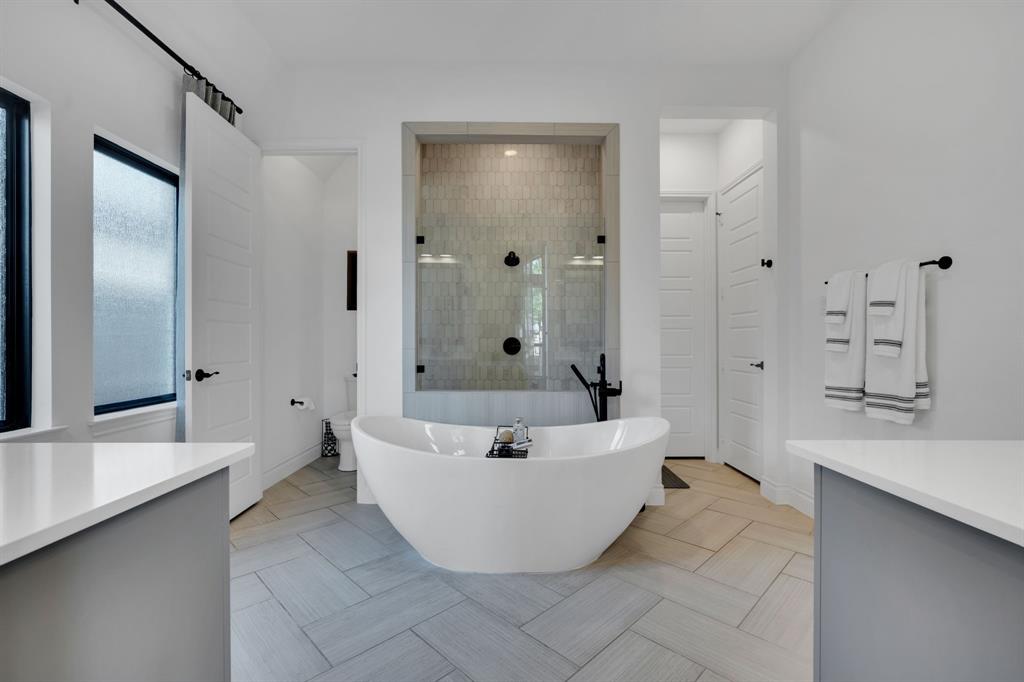 2221 Meridian Place Midlothian, TX 76065 - Photo 20 of 39 a spacious bathroom with a tub shower and mirror